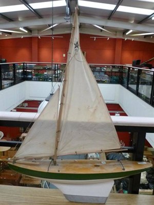 Lot 57 - A Wooden Star Yacht 'Comet', with green and white painted hull, lead keel, masts and sails,...
