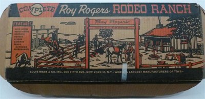 Lot 65 - A Boxed Marx Roy Rogers Rodeo Ranch No.3985, containing a tinplate building, plastic figures,...
