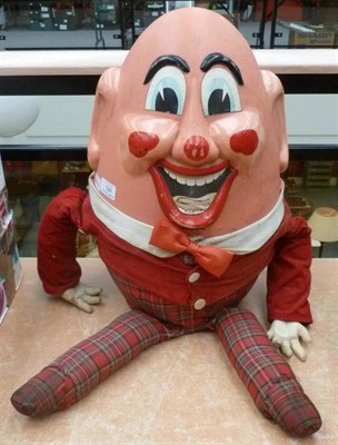 Lot 124 - A Large Humpty Dumpty Soft Toy, with pink plastic head, red cord jacket and tartan legs