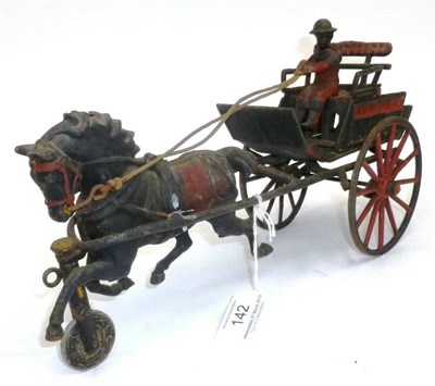 Lot 142 - An Early Cast Iron Horse Drawn Cart Toy, probably American, painted in black and red, with...