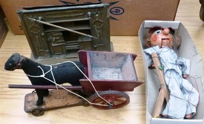 Lot 143 - Three Toys - brass model of a cooking range, a horse drawn wooden cart and a Pelham puppet