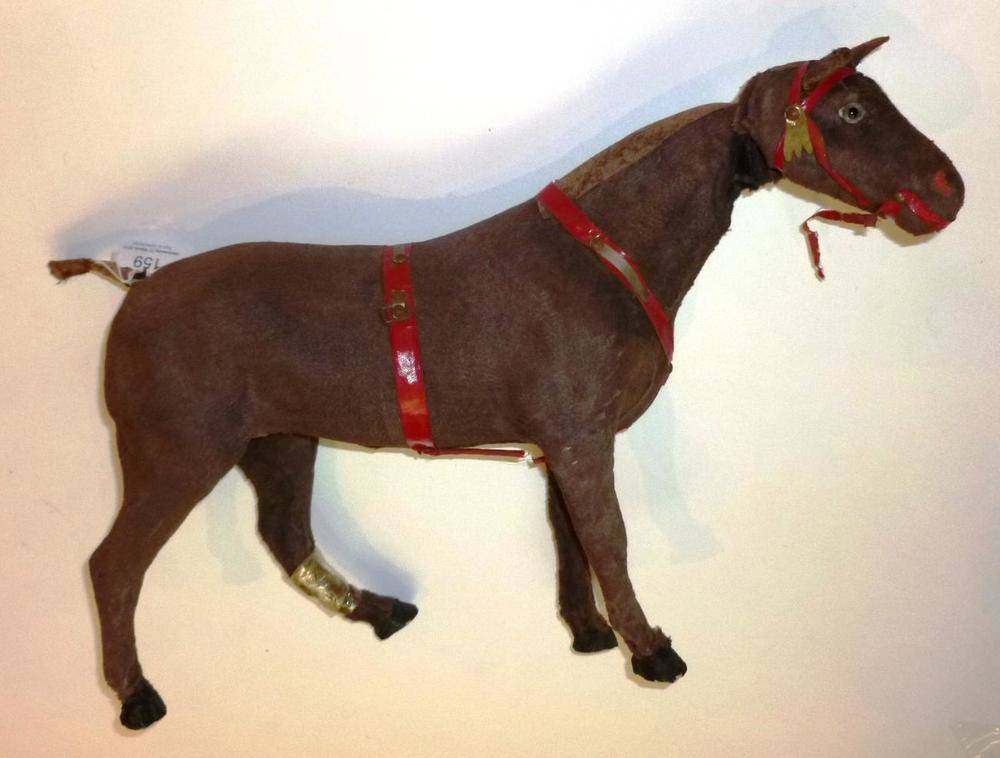 Lot 159 - A Clockwork Horse Automaton, with felt covered body, red harness, moving head and glass eyes,...