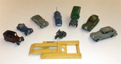 Lot 212 - Eight Early Dinky Vehicles, comprising four cars, land speed record car, covered wagon and...