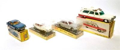 Lot 214 - Four Boxed Dinky Vehicles:- Superior Cadillac Ambulance No.267; Ford Capri No.165, with...