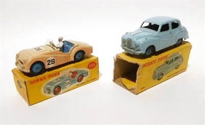 Lot 219 - Two Boxed Dinky Cars:- Triumph TR2 Sports No.111, with pink body, blue interior, white driver,...