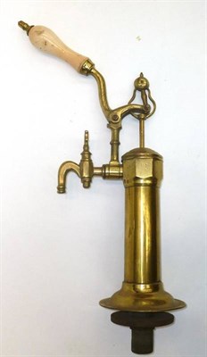 Lot 222 - An Early Brass Beer Pump, with ornate arm and porcelain handle