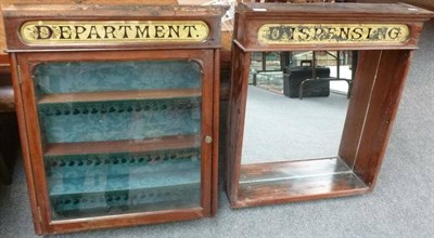 Lot 225 - A Pair of Wooden Wall Mounted Pharmacy 'Dispensing Department' Display Cabinets, both with gilt...