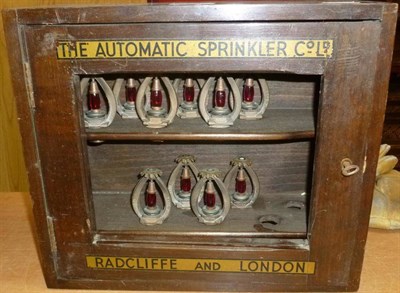 Lot 226 - A Pair of Wooden Wall Mounted Shop Display Cases of Sprinklers, inscribed 'The Automatic...