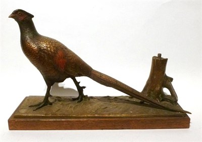 Lot 242 - A Cold Painted Spelter Strike-Lite Table Lighter in the Form of a Pheasant, mounted on a wooden...