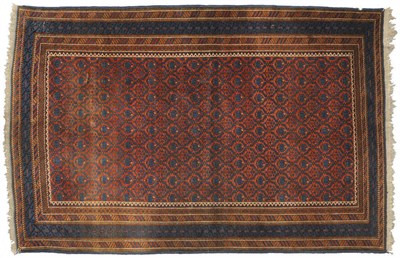 Lot 1338 - A Kuba Rug East Caucasus The madder lattice field of stylised flowers enclosed by polychrome barber