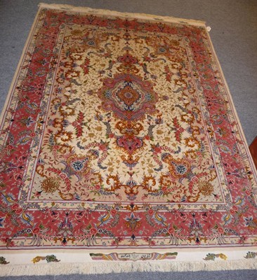 Lot 1347 - A Tabriz Rug Persian Azerbaijan The cream field of floral scrolling vines around a pole...