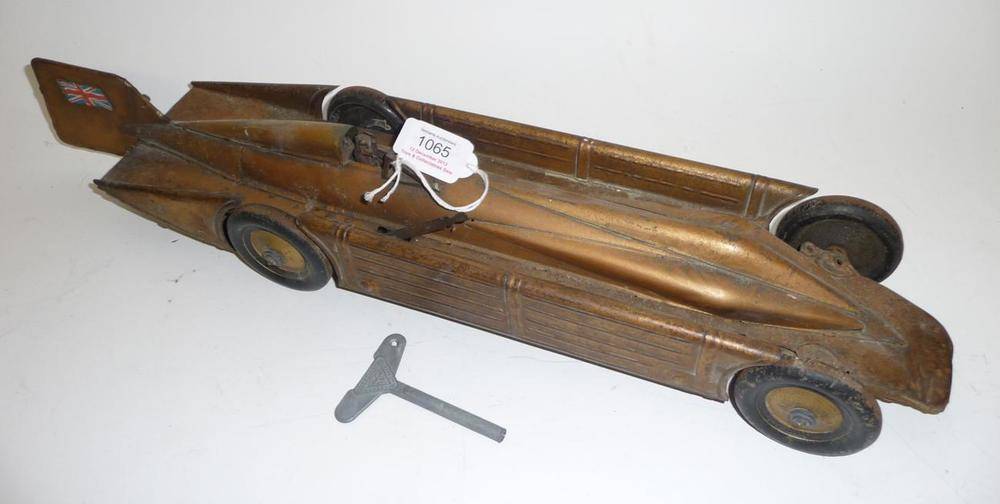 Lot 1065 - A Guntherman Clockwork Tinplate 'Golden Arrow' Land Speed Record Car, lithographed in gold,...