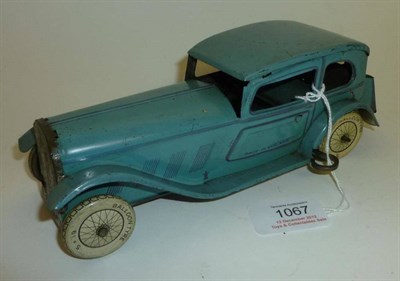 Lot 1067 - A Wells Clockwork Tinplate Coupe with Chauffer, lithographed in light blue, with Balloon tyres...