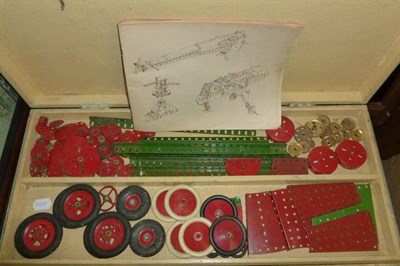 Lot 1072 - A Collection of Meccano, mainly red and green parts, also boxed No.1 clockwork motor, wheels, nuts