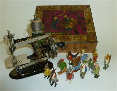 Lot 1078 - Twelve Cadburys Coco-Cub Lead Figures, hollowcast figures circa 1930's; A German Miniature Tinplate