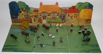 Lot 1101 - Britains Farm Series Lead Figures and a Cardboard Scenic Farm Backdrop, figures include five...