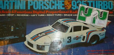 Lot 1119 - Two Remote Control Cars - boxed Martini Porsche 935 Turbo and Dick Cepek Big Wig, both with...