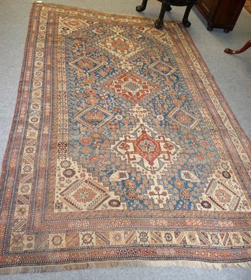 Lot 1359 - Large Kashgai Rug  South West Persia The mid indigo field with a column of linked medallions...