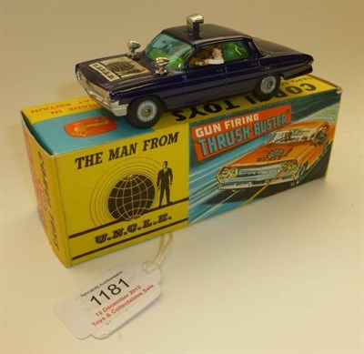 Lot 1181 - A Boxed Corgi The Man From U.N.C.L.E Gun Firing Thrush-Buster No.497, in metallic purple, with...