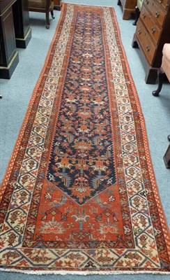 Lot 1360 - Malayir Runner  West Persia The indigo field of Herati design enclosed by ivory borders of stylised