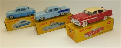 Lot 1219 - Three Boxed Dinky Two-Tone Cars:- Hudson Hornet Sedan No.174, in red and cream; Studebaker...