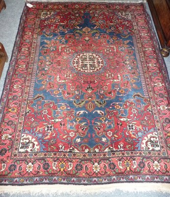 Lot 1367 - Tafrish Rug  Persian Kurdistan The sky blue field with typical salmon pink sunburst medallion...