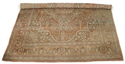 Lot 1368 - Tabriz Carpet  Persian Azerbaijan The faded madder field with stylised vines and flowers around...