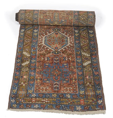 Lot 1370 - Karajah Runner of Narrow Size  Persian Azerbaijan The madder field with a single row of latch...