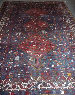 Lot 1371 - Khamseh Rug  South West Persia The shaded indigo field with three linked serrated salmon pink...