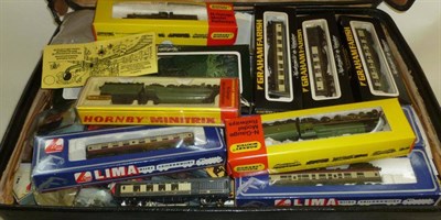 Lot 21 - A Collection of Boxed 'N' Gauge Trains and Accessories, including three Hornby Minitrix tender...