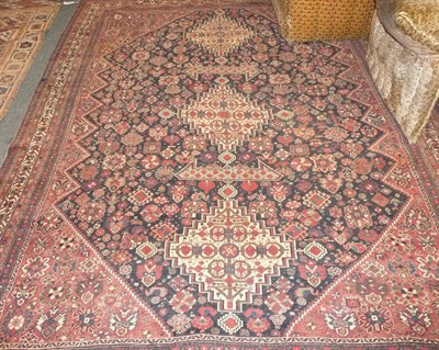 Lot 1373 - Afshar Rug  South Persia  The deep indigo field with three stepped medallions surrounded by...