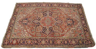 Lot 1374 - Heriz Carpet Persian Azerbaijan The stepped madder field of angular vines around a salmon pink...