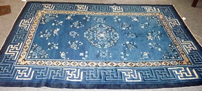 Lot 1375 - A Chinese Rug Probably Peking The soft indigo field with central skeletal medallion surrounded...