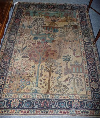 Lot 1376 - A Tabriz Rug Persian Azerbaijan The field depicting buildings and animals within a rural...