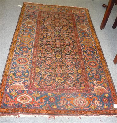 Lot 1377 - A Kurdish Rug Persian Kurdistan The deep indigo Herati field enclosed by "samovar" borders and...