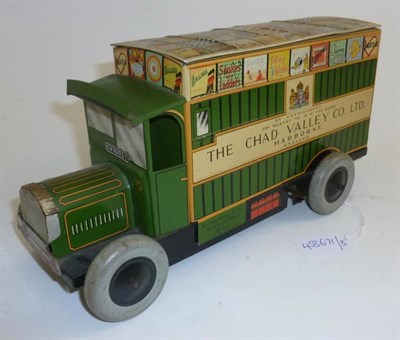 Lot 86 - A Chad Valley Clockwork Tinplate Games Van, lithographed in green, the roof area lithographed...