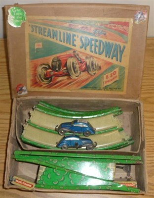 Lot 88 - A Boxed Marx Clockwork Tinplate Streamline Speedway Racing Set E50, containing green...