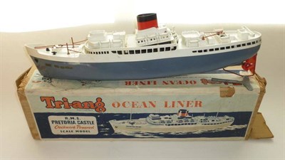 Lot 103 - A Boxed Tri-ang Clockwork Plastic R.M.S. Pretoria Castle Ocean Liner, in grey and white, red...