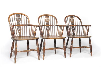 Lot 1380 - A Set of Three Lincolnshire 19th Century Yewwood Windsor Elbow Chairs, each stamped G Wilson...