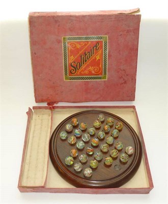 Lot 138 - A Boxed Solitaire Set, comprising thirty two hand blown 20mm multi-swirl marbles, some with...