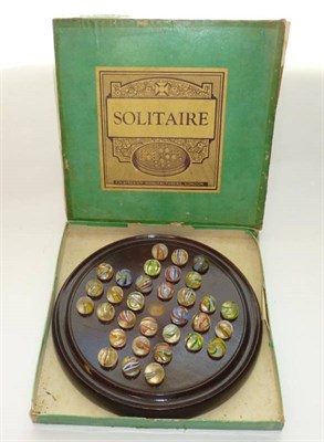 Lot 139 - A Boxed Solitaire Set, comprising thirty two hand blown 20mm multi-swirl marbles, some with...