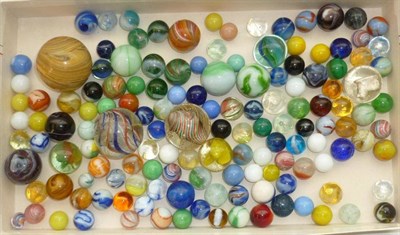 Lot 146 - A Collection of Vintage Marbles, including a 4cm onion skin, two large multi-swirls, sulphide...