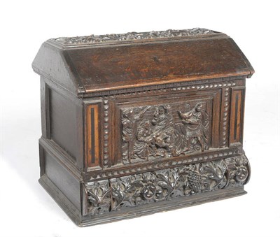 Lot 1384 - A Joined Oak Box, probably Low Countries, early 18th century, the canted lid carved in relief...