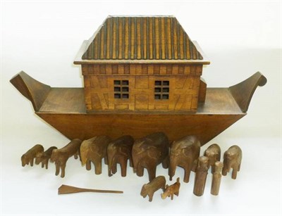 Lot 151 - A Wooden Boat Bottomed Noah's Ark, the lift off lid with fluted decoration, containing thirteen...