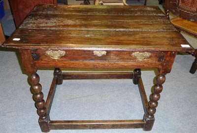 Lot 1385 - A 17th Century Stained Pine and Ash Side Table, the rectangular top above a single frieze...