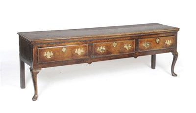 Lot 1386 - An Early 18th Century Oak Low Dresser, circa 1740, the rectangular top above three frieze...