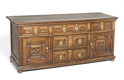 Lot 1391 - A Joined Oak Low Dresser, circa 1690, the rectangular top over three geometric moulded cushion...