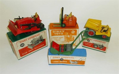 Lot 239 - Four Boxed Dinky Supertoys - Blaw Knox Bulldozer No.561, Dumper Truck No.562, Coventry Climax...