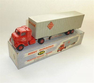 Lot 243 - A Boxed Dinky Supertoys McLean Tractor Trailer No.948, with red cab, grey plastic trailer (one door