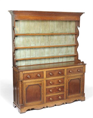 Lot 1396 - An Oak and Mahogany Enclosed High Dresser and Rack, mid 19th century, the projecting cornice...